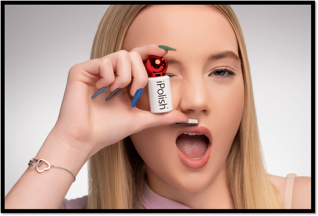 blonde woman holding polish for color changing nails
